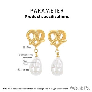 Detail of vintage heart-knot earrings with stainless steel and shell pearl drop details