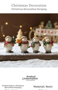 Detailed view of four resin snowman ornaments with colorful scarves on a snowy book