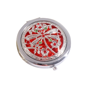 Vintage silver folding makeup mirror with red dragonfly and floral filigree pattern