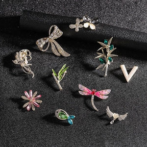 Detailed assortment of luxury enamel brooches with crystal rhinestones and pearls