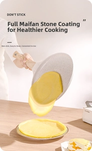 Action shot of Maifan stone non-stick pan pouring a thin crepe on a wooden table