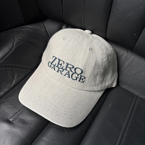 Detailed embroidery of ZERO GARAGE text on vintage cotton baseball cap with high density fabric