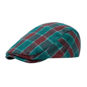 Classic red and green plaid newsboy cap in thick tweed fabric for a vintage winter style