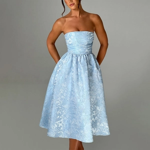 Close-up of light blue strapless dress featuring intricate floral jacquard fabric texture