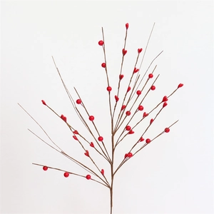 Vibrant red faux berry branches with natural stems for Christmas and New Year home decor