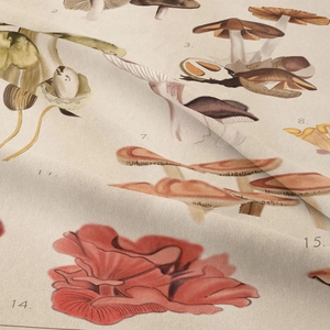 Close-up of vintage mushroom print on beige cotton linen fabric with natural textures