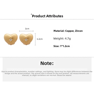 Detailed view of heart-shaped brushed gold earrings with zircon inlay and measurements