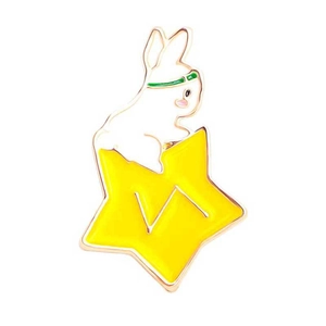Cartoon white bunny riding a yellow star metal enamel pin with a gold border