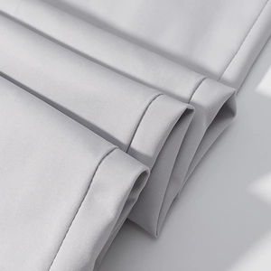 Macro shot of gray twill fabric texture and neat stitching for the suit set