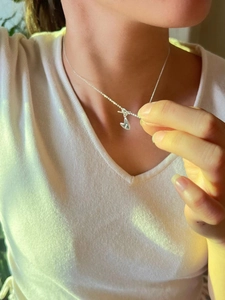 Elegant 925 sterling silver heart necklace with pig nose link chain worn by a model