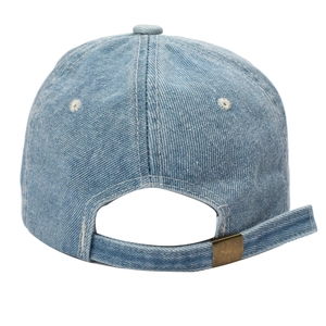 Detail of adjustable bronze metal buckle and contrast stitching on blue denim baseball cap