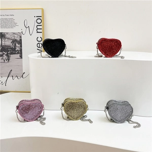 Sparkly heart-shaped mini chain bags in five colors on a white display stand
