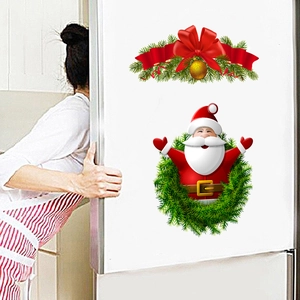 Christmas Santa Claus wreath and red bow pine branch stickers on a white refrigerator