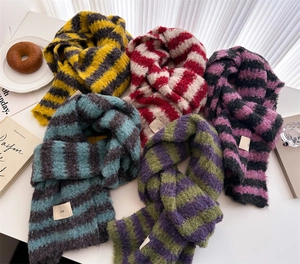 Flat lay of multiple color-block striped wool knit scarves with ins style labels