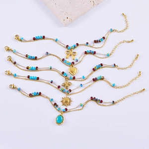 French vintage beaded bracelets with heart and bow pendants in gold and blue finish