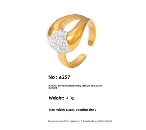 Detail of 18k gold plated titanium steel ring with sparkling Czech diamond inlay