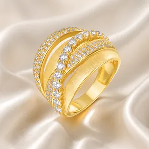 Macro shot of 925 silver four-layer ring with gold finish and moissanite stones