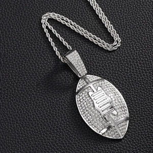 Close-up of silver American football pendant with sparkling rhinestones on twist chain