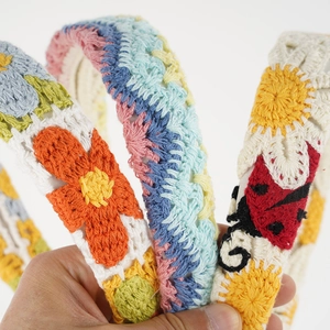 Handmade crochet headbands with colorful floral and ladybug patterns for women