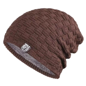 Detail of dark brown knitted beanie with warm fleece lining and basket weave texture