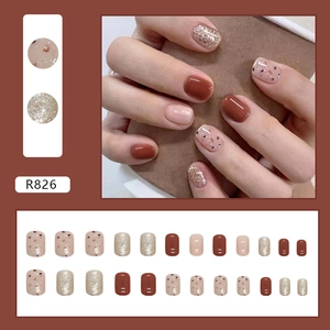 Short square press-on nails set in caramel brown and champagne glitter finish