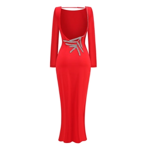 Detailed back view of red backless maxi dress featuring elegant silver leaf embroidery