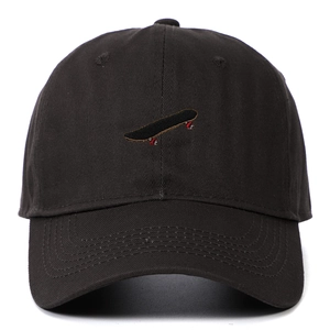 Detail of multi-color skateboard embroidery on a black six-panel cotton baseball cap
