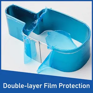 Ice cream shaped stainless steel cookie cutter with blue protective film being peeled off