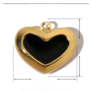 Macro detail of gold-framed black enamel heart pendant with dimensions and weight info