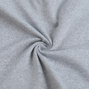 Close-up of soft grey knit fabric texture showing elasticity and ruffled material detail
