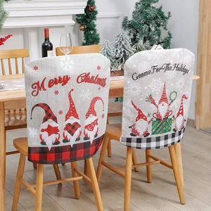 Christmas gnome chair covers with red black plaid pattern and linen texture for dining decor