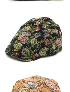 Detailed view of jacquard beret hat with vintage flower patterns and metallic side buckle