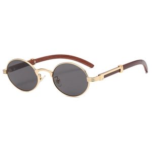 Retro round sunglasses with gold metal frame and brown wood grain temples on white background