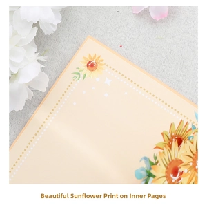 Detail of elegant sunflower printing on creamy stationery card with white polka dot border
