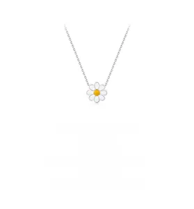 Detail shot of s925 sterling silver daisy pendant with white enamel petals and yellow core