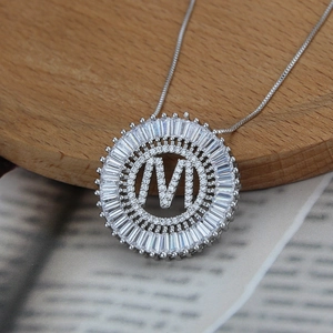 Silver plated round letter M pendant necklace with white cubic zirconia and box chain