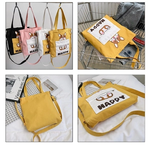 Detail of cute Corgi print canvas tote bag in four colors showing straps and texture
