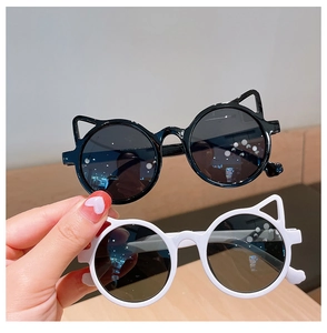 Detail of cute cat ear sunglasses for kids in black and white frames with dark lenses