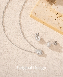 Detailed view of S925 sterling silver jewelry set with oval stones and sunflowers