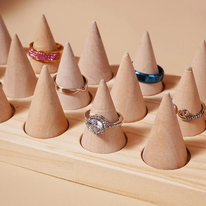 Solid wood cone ring displays showcasing diverse premium wedding and fashion rings