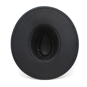Top view of black wide brim wool jazz hat showing interior adjustable strap and sweatband