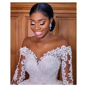 Elegant white lace long sleeve wedding dress with V-neck embroidery and vintage train