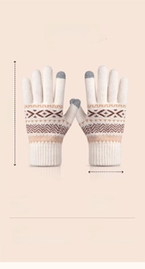 Detailed view of winter knit gloves with snowflake pattern and touch screen fingertips