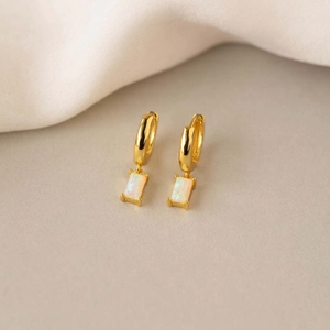 Detailed close-up of gold hoop earrings with rectangular opal stone pendants for women