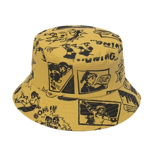 Bright yellow bucket hat with retro comic print featuring manga style skater girl and graphics