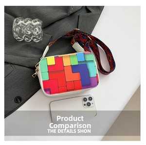 Detail of white crossbody bag with colorful geometric patterns and a wide woven strap