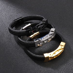 Men's braided leather bracelet with stainless steel accents in black, silver, and gold
