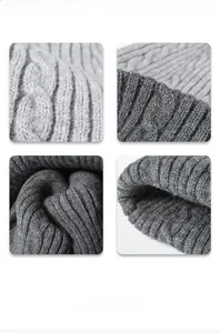 Detailed macro view of gray cable knit pattern and ribbed edge texture of the beanie