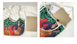 Detailed view of the oil painting tote bag showing internal space and iPad size comparison