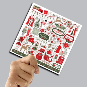 Close-up of vintage Christmas scrapbooking papers featuring festive holiday illustrations